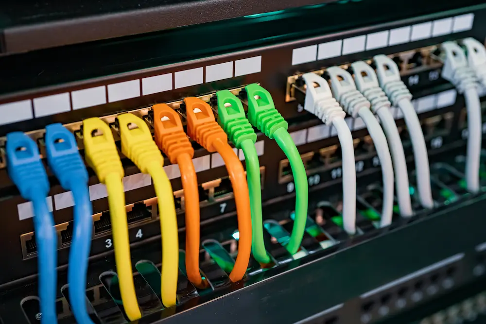 Professional network installation with color-coded Ethernet cables for a small business in St. Louis County - part of Tek4's comprehensive IT support services